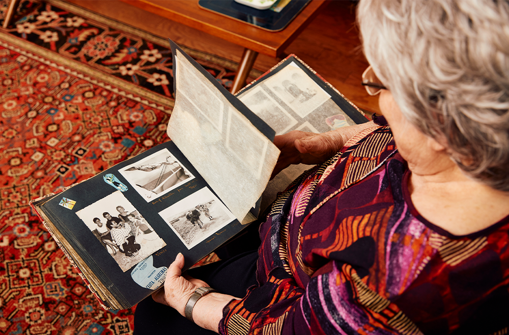 MiMi Reed looking at photo album